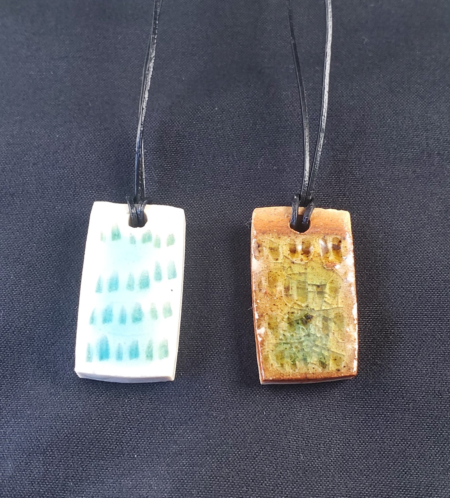 Ceramic Jewellery Pendant Set - one brown one white with blue glass / glaze